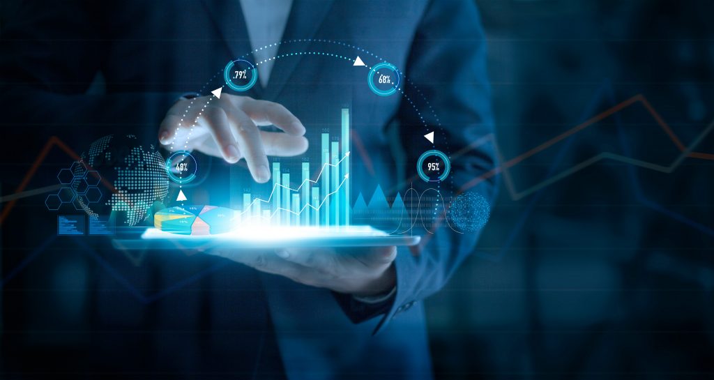 Businessman using tablet analyzing sales data and economic growth graph chart on virtual interface. Business strategy. Abstract icon. Digital marketing.